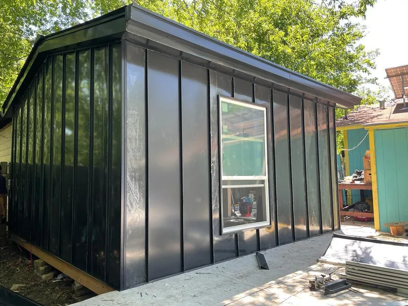 Black standing seam metal wall panels for Roof Inspection in Redmond